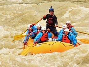 Sitting at the front of the raft, Tyson McNalley and his wife Sheralyn are the first in line to get hit with the freezing glacial waters of the Kicking Horse River. (Glacier Rafting Co. photo)