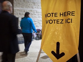 Citizens arrive at an election polling station in 2011.
(ERROL McGIHON/OTTAWA SUN)