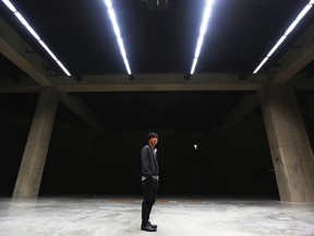 South Korean-born artist Sung Hwan Kim poses at the official opening of The Tanks, new galleries within the Tate Modern art gallery in London July 16, 2012.  REUTERS/Luke MacGregor