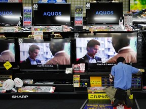 Sharp Corp's Aquos television sets are displayed at an electronics shop in Tokyo July 24, 2012. (REUTERS/Issei Kato)