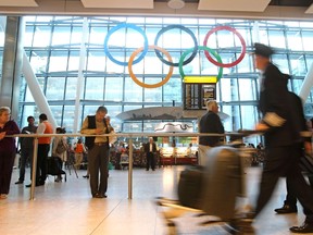 Giant 2012 Olympic rings are unveiled at Heathrow Airport's Terminal 5, west of London, on June 20, 2012. (AFP PHOTO /LOCOG)