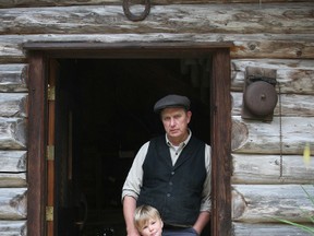 Durham area raw milk advocate Michael Schmidt and his four year old son William at his Durham area farm on Friday September 30, 2011. James Masters\The Sun Times