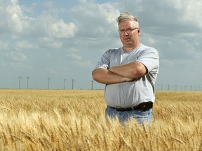 Morris-area grain farmer Rolf Penner is pleased that the Canadian Wheat Board’s monopoly is ending. This grain farmer you’re shooting is happy to see the monopoly ending. Photographed southeast of Morris on Wed., July 25, 2012.
JASON HALSTEAD/Winnipeg Sun
