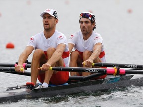 Canada's Douglas Vandor and Morgan Jarvis row in compete in the men's lightweight double sculls repechage at Eton Dorney during the London 2012 Olympic Games July 31, 2012. REUTERS/Darren Whiteside