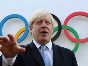 Boris Johnson, London mayor, got stuck in the air while trying to make a dramatic entry to an Olympic party on Wednesday, Aug. 1, 2012. (Reuters/Scott Heavey/Pool)