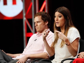 Cast member Jennifer Carpenter speaks, as co-star Michael C. Hall watches, at a panel for "Dexter" during the Showtime television portion of the Television Critics Association Summer press tour in Beverly Hills, California July 30, 2012. (Reuters/MARIO ANZUONI)