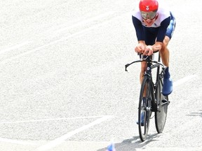 Bradley Wiggins won Great Britain's first gold of the 2012 London Games by taking Wednesday's men's time trial cycling final. (WENN.com)