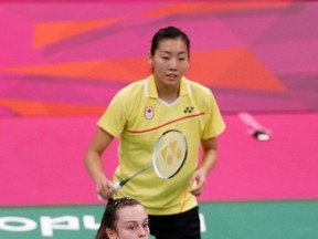 Canada's Alex Bruce (front) and Michele Li play against Russia's Valeria Sorokina and Nina Vislova during their women's doubles Group A match during the London 2012 Olympic Games, July 31, 2012. (BAZUKI MUHAMMAD/Reuters)