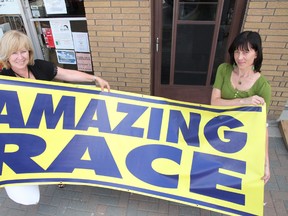 Lynn Mazzuca, left, and Trisha Mazzuca hold a banner promoting the Capreol Amazing Race at last year's Capreol Days. JOHN LAPPA/THE SUDBURY STAR/QMI AGENCY