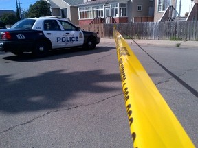 Police at the scene of a man's death at 109A Avenue and 98 Street in Edmonton. (PERRY MAH/EDMONTON SUN)
