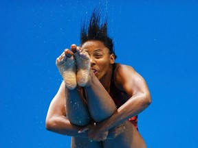 Canada's Jennifer Abel performs a dive during the women's 3m springboard semi-final at the London 2012 Olympic Games at the Aquatics Centre August 4, 2012.