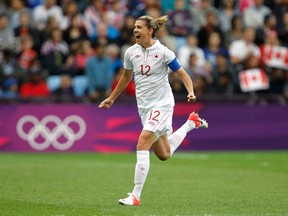 Canada's Christine Sinclair celebrates scoring on a free kick over Britain in the women's quarterfinal soccer match in Coventry at the City of Coventry stadium at the London 2012 Olympic Games  August 3, 2012.  REUTERS/Alessandro Garofalo