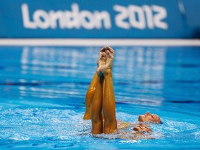 Canada's Marie-Pier Boudreau Gagnon and Elise Marcotte perform in the synchronised swimming duets technical routine qualification round during the London 2012 Olympic Games at the Aquatics Centre Sunday. (REUTERS)