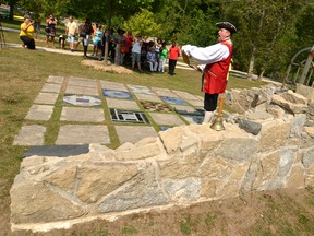 Former Owen Sounder and now Gravenhurst towncrier Bruce Kruger reads a proclamation at the cairn rededication ceremony Saturday in Harrison Park during the 150th anniversary of the Emancipation Festival in this file photo.