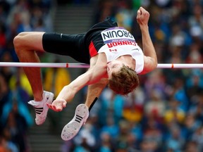 Canada's Derek Drouin competes in the men's high jump final during the London 2012 Olympic Games at the Olympic Stadium Aug. 7, 2012.  REUTERS/Kai Pfaffenbach
