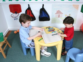Boys share a table in a kindergarten class.
FILE PHOTO