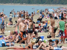 Visitors crowd the beach at Sauble Beach.