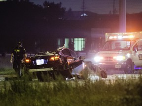 A Lexus has extensive damage after a collision with a tractor-trailer killed the luxury vehicle's driver early Wednesday, Aug. 15, 2012, on the 401 in Mississauga. (VICTOR BIRO photo)