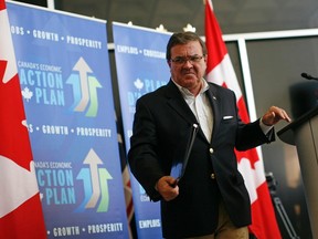 Canada's Finance Minister Jim Flaherty leaves following a news conference in Ottawa August 15, 2012.    REUTERS/Chris Wattie