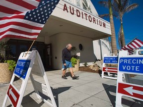 A voter leaves a polling station after casting his ballot in the Florida Republican presidential primary election in Sarasota, Florida January 31, 2012.  REUTERS/Steve Nesius