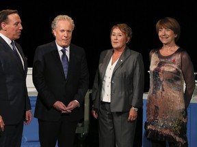 From left to right: Coalition Avenir Quebec (CAQ) leader Francois Legault, Liberal leader Jean Charest, Parti Quebecois leader Pauline Marois, and Quebec Solidaire co-leader Francoise David, pose before a Quebec leaders' debate in Montreal August 19, 2012. (REUTERS/Christinne Muschi)