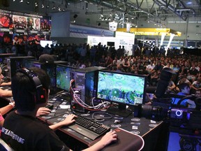 Members of team Team SoloMid (TSM) from the United States are shown competing during the 2011 League of Legends competition of the Intel Extreme Masters Gamescom in Cologne, Germany in this publicity photo released to Reuters on August 17, 2012. (REUTERS/Gamescon/Handout)