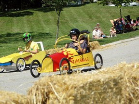Chris Van Moorsel, left, and Natalie Pinder race down the swimming pool hill during the soap box derby at Cornfest Aug. 18. Results are as follows: age 9-11,   Michael McGuire, 1st; Sam Gaffney, 2nd; Rylie Dietz, 3rd. Age 12-13, 1st, Jim Tubb (fastest time of the day, too); 2nd, Ryan Williamson; 3rd, Abby Luckhardt (also won best looking car). Age 14-16, 1st, Natalie Pinder; 2nd, Quinton McDougall; 3rd, Matthew Duncan. 17 and over, first place to Steve Pinder. The Brian Van Moorsel Memorial award to Sliver (Steve Tubb).