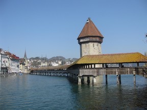Standing since 1333, Lucerne's Chapel Bridge draws many visitors because of its elegant beauty. KENNETH BAGNELL PHOTO