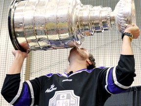 Ex-Chatham Maroon Kevin Westgarth of the Los Angeles Kings kisses the Stanley Cup during a visit to his hometown of Amherstburg. (DAVE JEWELL/QMI Agency)