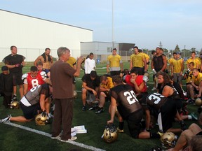 Bisons head coach Brian Dobie speaks to players during Thursday's practice. (Photo courtesy of Chris Zuk)