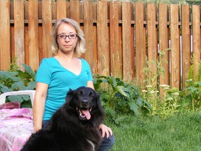 Angie Prime poses with her border collie, Vicious, who protected Prime when a cougar came into her Trail B.C. home and attacked. (PHOTO COURTESY ANGIE PRIME)