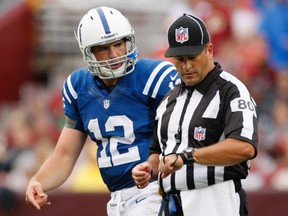Colts quarterback Andrew Luck (left) talks with referee John Petrone during an NFL preseason game Aug. 25, 2012. The NFL will be using replacement refs during the opening week. (Jonathan Ernst/Reuters)