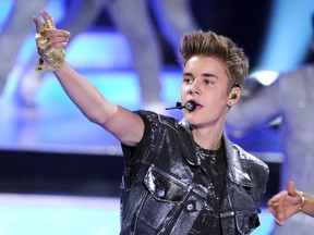 Singer Justin Bieber accepts the Male Summer Music Star award onstage during the 2012 Teen Choice Awards at Gibson Amphitheatre on July 22, 2012 in Universal City, California.  Kevin Winter/Getty Images/AFP