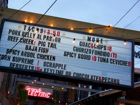 The menu billboard is seen at Mexican restaurant Grand Electric in Toronto August 15, 2012. For 11 days this month Toronto will be the cinematic center of the universe during its annual film festival and hungry movie-goers will have plenty of food choices thanks to the city's flourishing restaurant scene. Toronto has lured high-profile foreign chefs and the international media are starting to recognize it as a culinary destination. (REUTERS/Claire Sibonney)