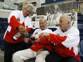 Canada '72 player,  Marcel Dionne,  pours some of Team Canada's wine to teammates Bill White (M)  and Ron Ellis (R). The three legends where at  last month's Heritage Hockey announcement for plans to celebrate the 40th Anniversary of Team Canada '72.  (Craig Robertson, QMI Agency)