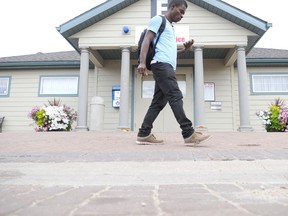 GPRC student Holland Omosomwan walks by the housing office of GPRC at the start of the 2012/2013 term. Housing spots on campus are full for this upcoming 2013/2014 term, but college staff are around and able to help students find the right off-campus housing options. (DHT file photo)