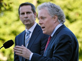 Dalton McGuinty and Jean Charest in Quebec City, June 2010. (Reuters files)