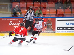 Austin Masse dodges a Beardy?s Blackhawks player during last year?s Mac?s AAA Midget tournament. Masse will likely lead a strong Airdrie contingent with the Strathmore-based UFA Bisons this season.