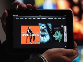 An employee demonstrates the new Kindle Fire HD 8.9" at Amazon's Kindle Fire event in Santa Monica, California September 6, 2012. Amazon.com Inc unveiled a larger, high-speed Kindle Fire tablet on Thursday for $499, challenging Apple Inc's dominant iPad and intensifying a battle with Google Inc and Microsoft in the booming tablet arena. (Gus Ruela/REUTERS)
