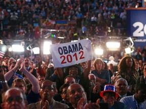 Gloria Goodwin, a delegate from North Carolina, holds up an Obama 2012 banner as she celebrates with fellow delegates during the final session of the Democratic National Convention in Charlotte, North Carolina, September 6, 2012.  (REUTERS/Adrees Latif)
