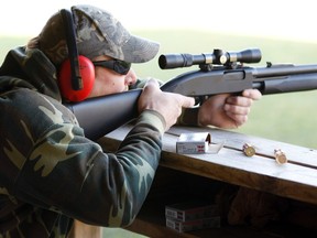 A hunter fires during a sighting in and test-firing of shotguns and rifles in a safe environment for the upcoming deer hunting season at the Illinois State Police firing range in Joliet, Illinois on November 12, 2011. (REUTERS/Jeff Haynes)