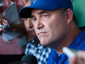 Blue Jays manager John Farrell fields questions from reporters in the dugout before last night’s game against the Red Sox at Fenway Park. Rumours have swirled that Farrell, who has previously worked with the Boston organization, could be headed back to Beantown. That leaves Jays GM Alex Anthopoulos with a decision or two. (REUTERS)
