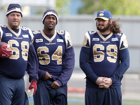 Winnipeg Blue Bombers tackle Glenn January (right) said the Banjo Bowl loss to Saskatchewan Sunday is one that will "make you sick."
JASON HALSTEAD/Winnipeg Sun