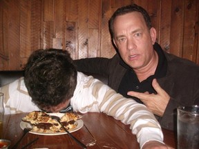 Photos posted online of actor Tom Hanks posing with a fan pretending to be drunk have gone viral. (imgur.com)
