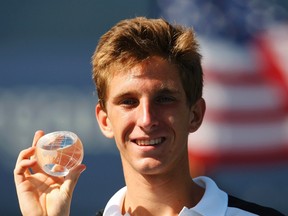 Filip Peliwo poses after defeating Liam Broady of Britain in their junior boy's singles finals match at the U.S. Open tennis tournament in New York September 9, 2012.    REUTERS/Eduardo Munoz