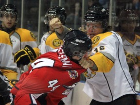 Sarnia Sting forward Craig Hottot, right, winds up on Windsor Spitfires defenceman Adam Bateman during a first period fight in a preseason game. Hottot was suspended 10 games for a hit to the head of Guelph's Ryan Horvat Friday. PAUL OWEN/THE OBSERVER/QMI AGENCY
