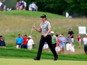 Rory McIlroy of Northern Ireland walks up to the 15th green during the final round of the PGA Championship golf tournament in Carmel, Indiana September 9, 2012.  REUTERS/Brent Smith
