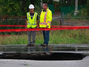 Hwy. 174 east bound was closed for days in September after a giant sinkhole swallowed a car. (File photo/Tony Caldwell/Ottawa Sun)
