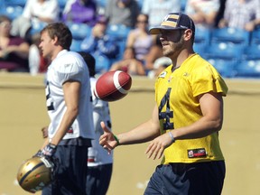 Winnipeg Blue Bombers QB Buck Pierce plays with a ball during football practice at Canad Inns Stadium on Mon., Aug. 20, 2012. (JASON HALSTEAD/Winnipeg Sun)