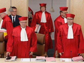President of the German Constitutional Court Andreas Vosskuhle, right, arrives with other judges for the hearing on the European Stability Mechanism (ESM) and the fiscal pact in Karlsruhe July 10, 2012. (REUTERS/Alex Domanski)